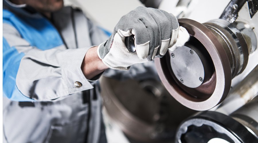 A man working with cnc lathe